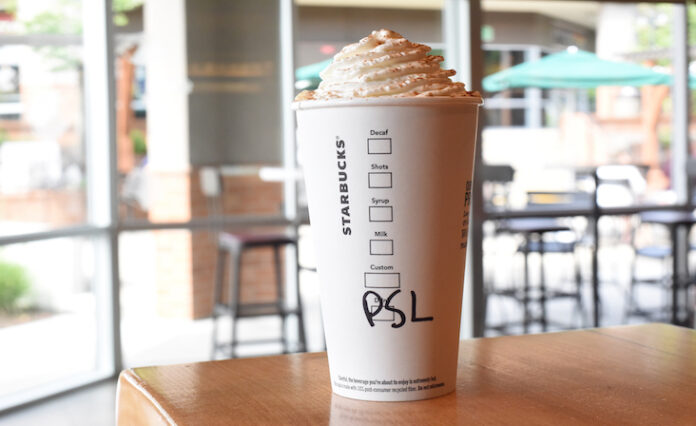 A Starbucks Pumpkin Spice Latte on a table