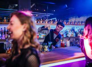 Leading Brands and On-premise Trends barman pouring drinks at the nightclub
