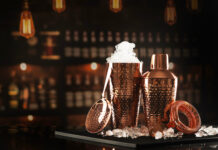 Presenting the 2026 Cheers Movers & Shakers Set of accessories for bartending. Shaker and glass for mixing cocktails made of copper. Set for making cocktails in copper color. Ice in glass for mixing cocktails.