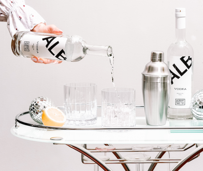 ALB vodka being poured on bar cart