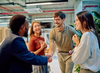 Tips For Improving Your Field Sales Results Managers shaking hands during a business meeting in modern office