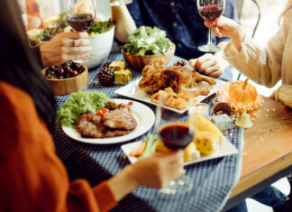 people enjoying wine and food