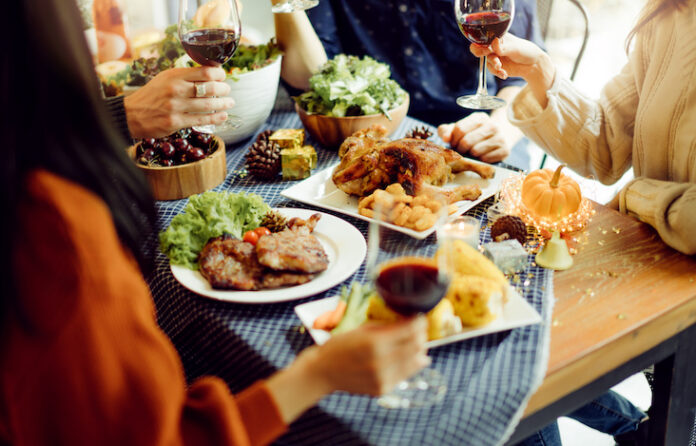 people enjoying wine and food