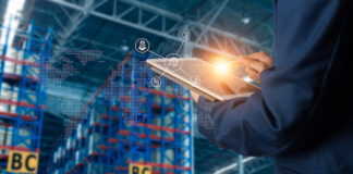 Businessman manager using tablet check and control and planning for Modern Trade warehouse logistics
